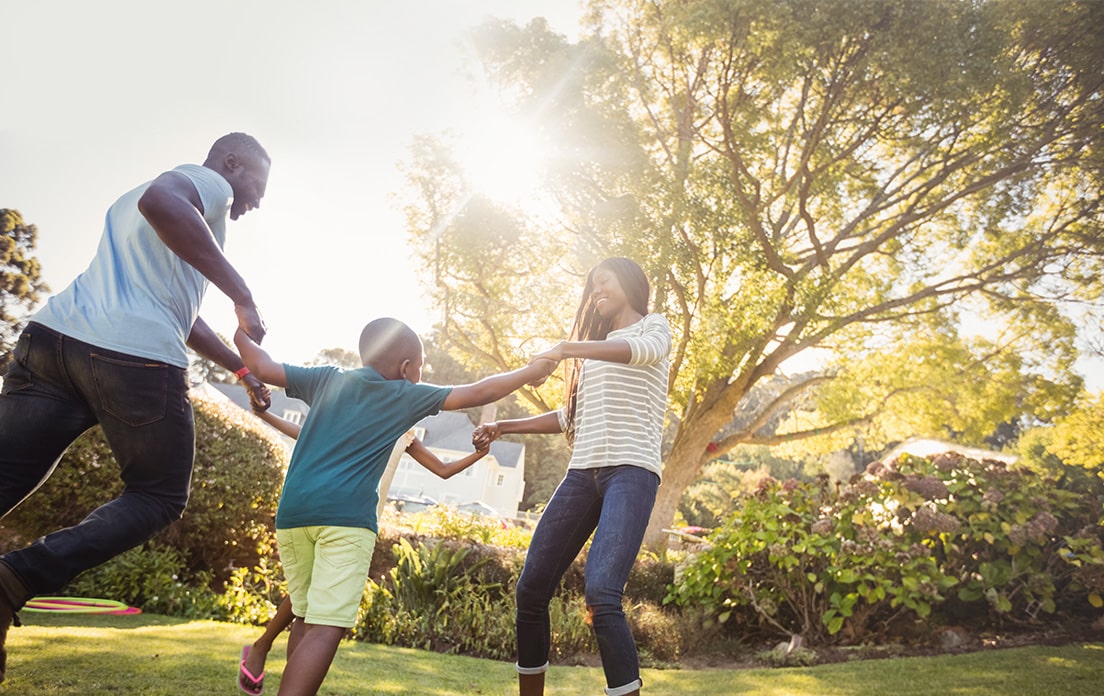 Family playing outside in the yard